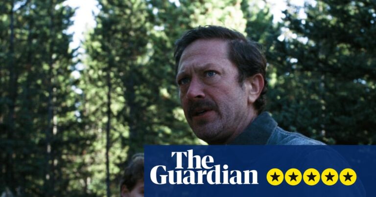 Actors Fred Hechinger and Ebon Moss-Bachrach standing in a wood in the daytime, in a still from A Long Winter.