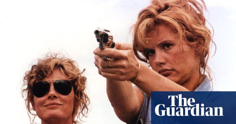 Thelma and Louise outdoors, with Geena Davis aiming a handgun as Susan Sarandon watches