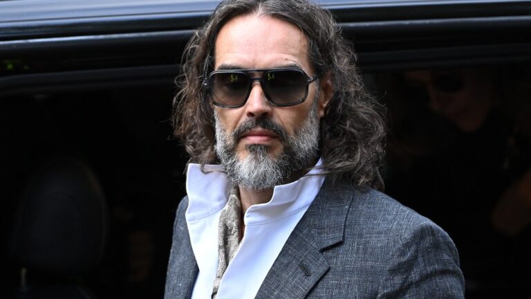LONDON, ENGLAND - OCTOBER 12: Russell Brand arrives at court ahead of his trial, where he faces rape and sexual assault charges at Southwark Crown Court on October 12, 2026 in London, England. Russell Brand has been charged with three counts of rape, three counts of sexual assault and one count of indecent assault. He has denied all charges (Photo by Leon Neal/Getty Images)